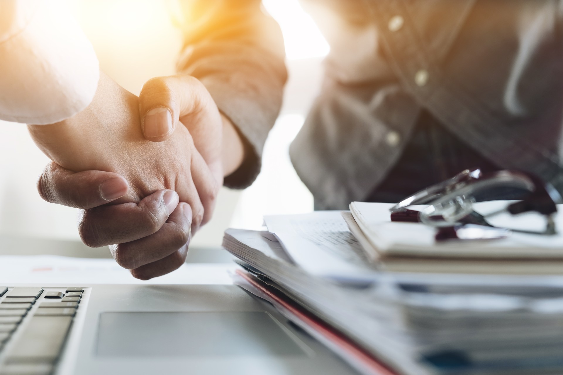 Close up of Business people shaking hands, finishing up meeting, business etiquette, congratulation, merger and acquisition concept